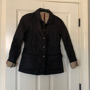 Burberry Jacket with snap closure. In good shape, normal wear.